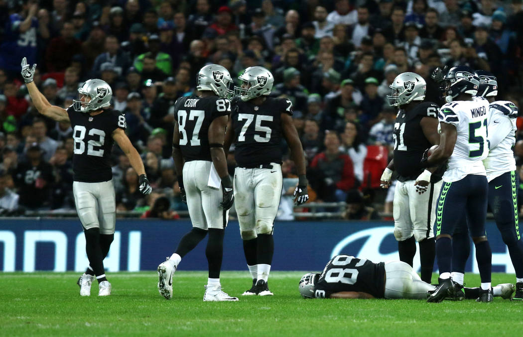 Oakland Raiders wide receiver Amari Cooper (89) lays on the field unconscious after getting hit by Seattle Seahawks strong safety Bradley McDougald (30), not pictured, during the first half of an ...