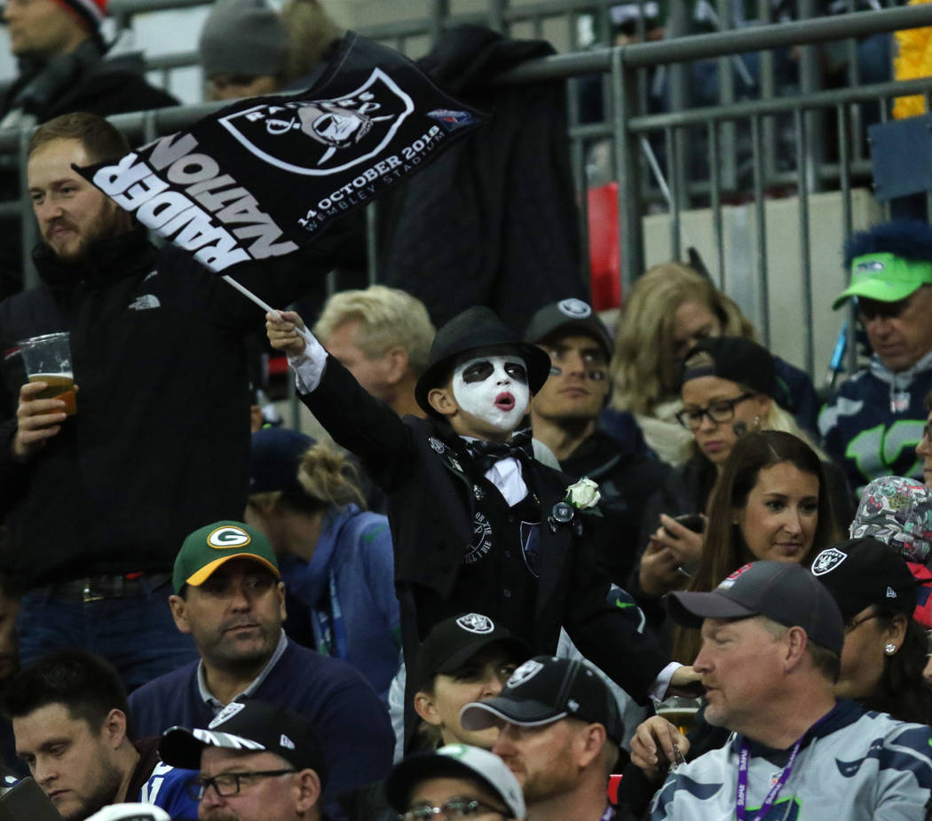 A young Oakland Raiders fan waves the team flag during the first half of an NFL game at Wembley Stadium in London, England, Sunday, Oct. 14, 2018. Heidi Fang Las Vegas Review-Journal @HeidiFang