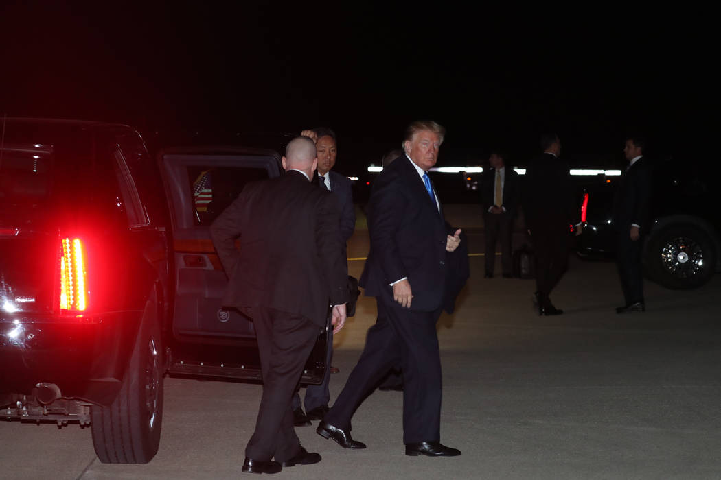 President Donald Trump boards Air Force One at Blue Grass Airport in Lexington, Ky., Saturday, Oct. 13, 2018, after speaking at a rally in Richmond, Ky. (AP Photo/Andrew Harnik)
