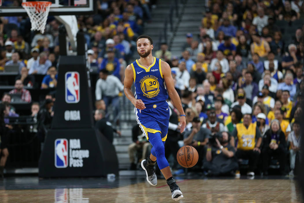 Golden State Warriors guard Stephen Curry (30) walks the ball up the court against the Los Angeles Lakers in the NBA game at T-Mobile Arena in Las Vegas, Wednesday, Oct. 10, 2018. Erik Verduzco La ...