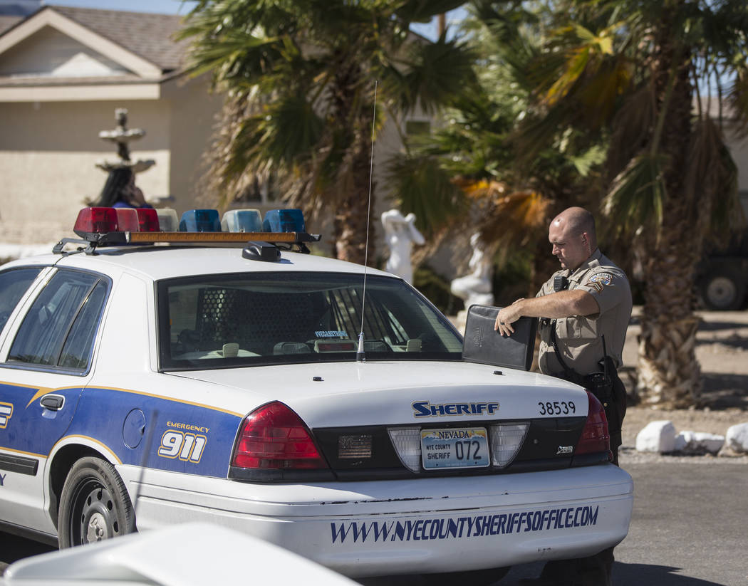 Nye County law enforcement investigate the scene at Dennis Hof's Love Ranch after the prominent brothel owner was found dead this morning at Dennis Hof's Love Ranch on Tuesday, Oct. 16, 2018, in P ...
