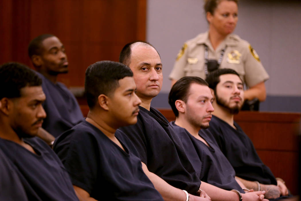 Former Marine Walter Laak, center, waits for sentencing at the Regional Justice Center Tuesday, Oct. 16, 2018. Laak was found guilty but mentally ill of attempted murder with a deadly weapon for a ...