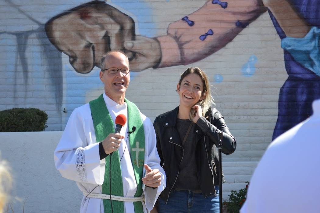 Pastor Brad Beckman thanks muralist Heather Toledo outside First Good Shepherd Lutheran Church in downtown Las Vegas during a mural dedication on Sunday, Oct. 14, 2018. Toledo spent five months pa ...