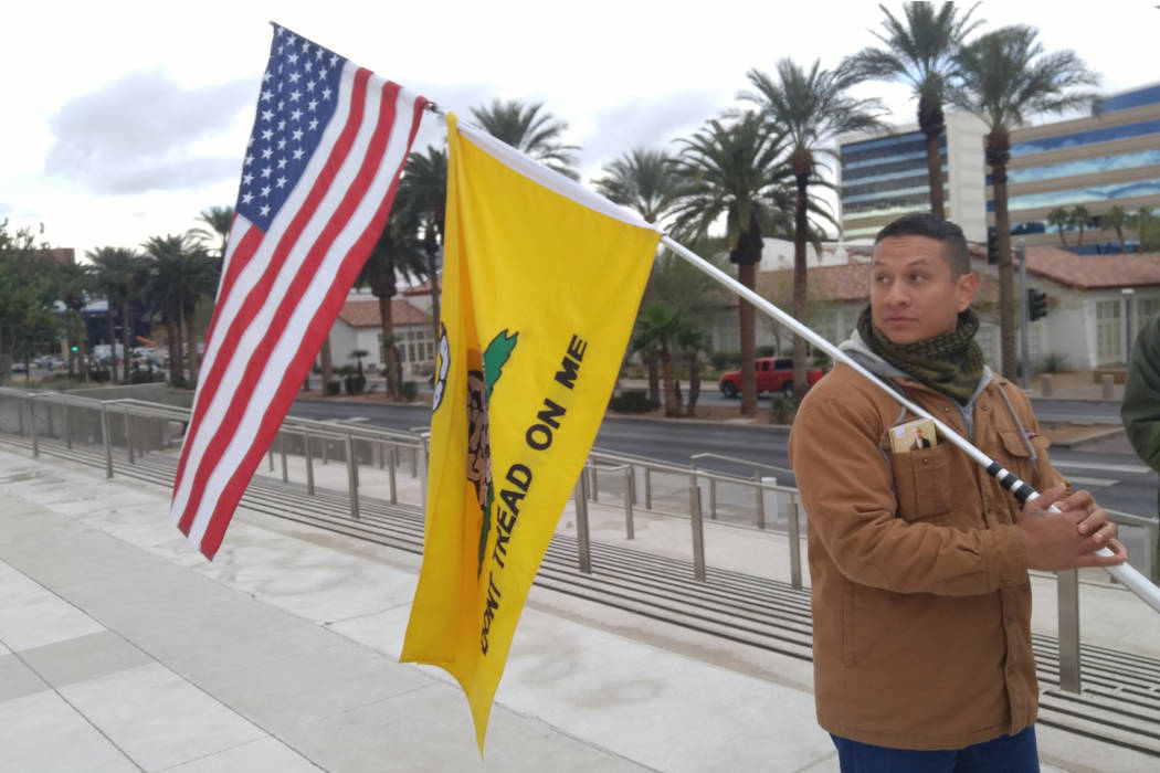 Joshua Martinez, 28, of Las Vegas, stands outside the Lloyd D. George U.S. Courthouse on Friday to show support for Ryan Bundy, who was in court. (Ben Botkin/Las Vegas Review-Journal) @benbotkin1