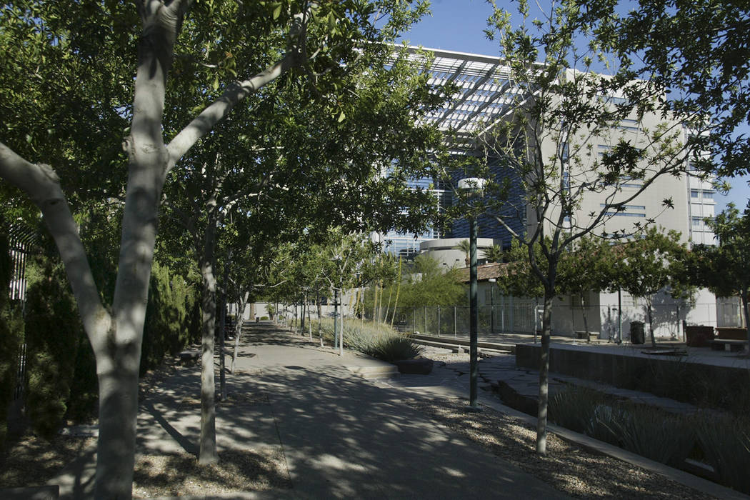 The Lloyd George U.S. Courthouse is shown through trees along a walkway in Centennial Plaza on Sunday, June 22, 2008, in downtown Las Vegas. (Las Vegas Review-Journal File)
