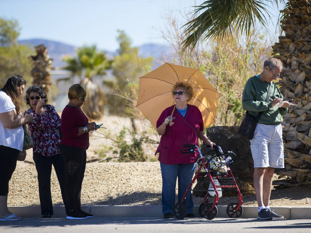 Paula Henry, center, of North Las Vegas lines up outside of the Primm Valley Lotto Store as people wait to buy the Mega Millions lottery tickets in Primm on Thursday, Oct. 18, 2018. It was Henrys ...