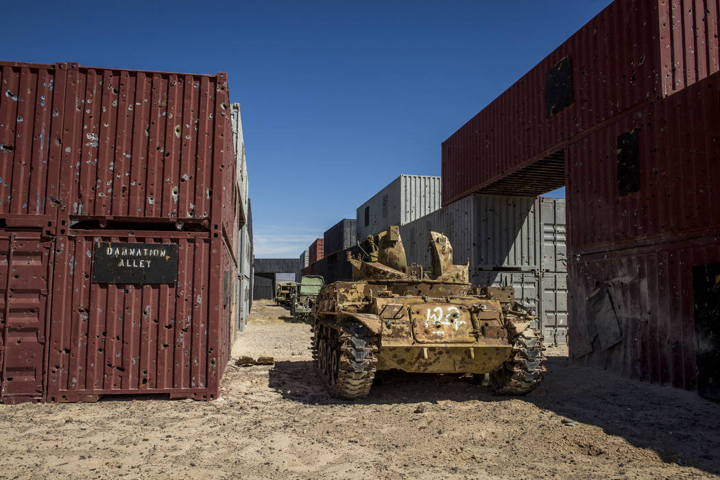 An armored vehicle riddled with bullet holes waits in "Damnation Alley," where aircraft and ground troops practice attacks in an urban setting deep inside the Nevada Test and Training Range. Patri ...