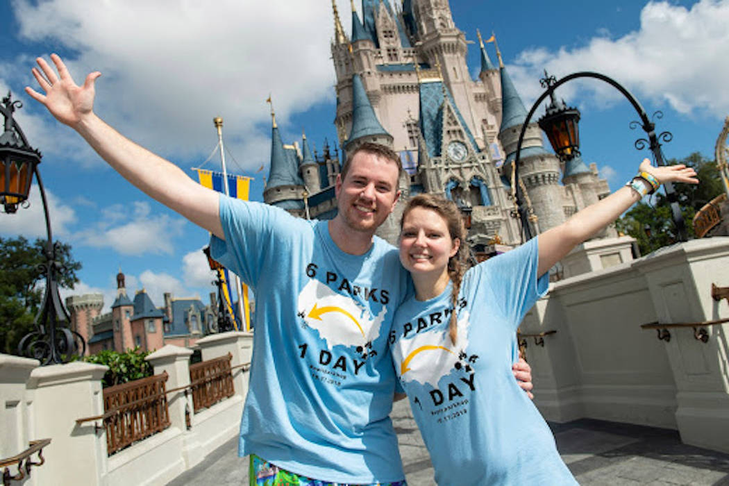 Clark and Heather Ensminger of Kingsport, Tenn., pose in front of the iconic Cinderella Castle in Magic Kingdom Park at Walt Disney World Resort in Lake Buena Vista, Fla. (Courtesy Disney Parks)