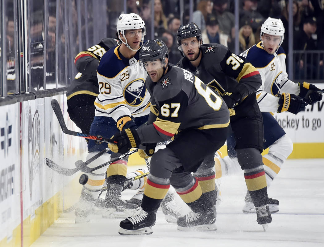 Vegas Golden Knights left wing Max Pacioretty (67) and left wing Tomas Hyka (38) skate for the puck against Buffalo Sabres right wing Jason Pominville (29) and defenseman Rasmus Ristolainen (55) d ...