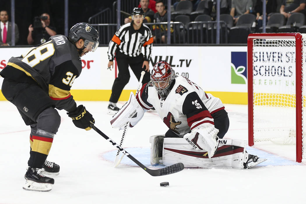 Golden Knights right wing Tomas Hyka (38) looks to shoot past Arizona Coyotes goaltender Darcy Kuemper (35) during the first period of a preseason NHL hockey game at T-Mobile Arena in Las Vegas on ...