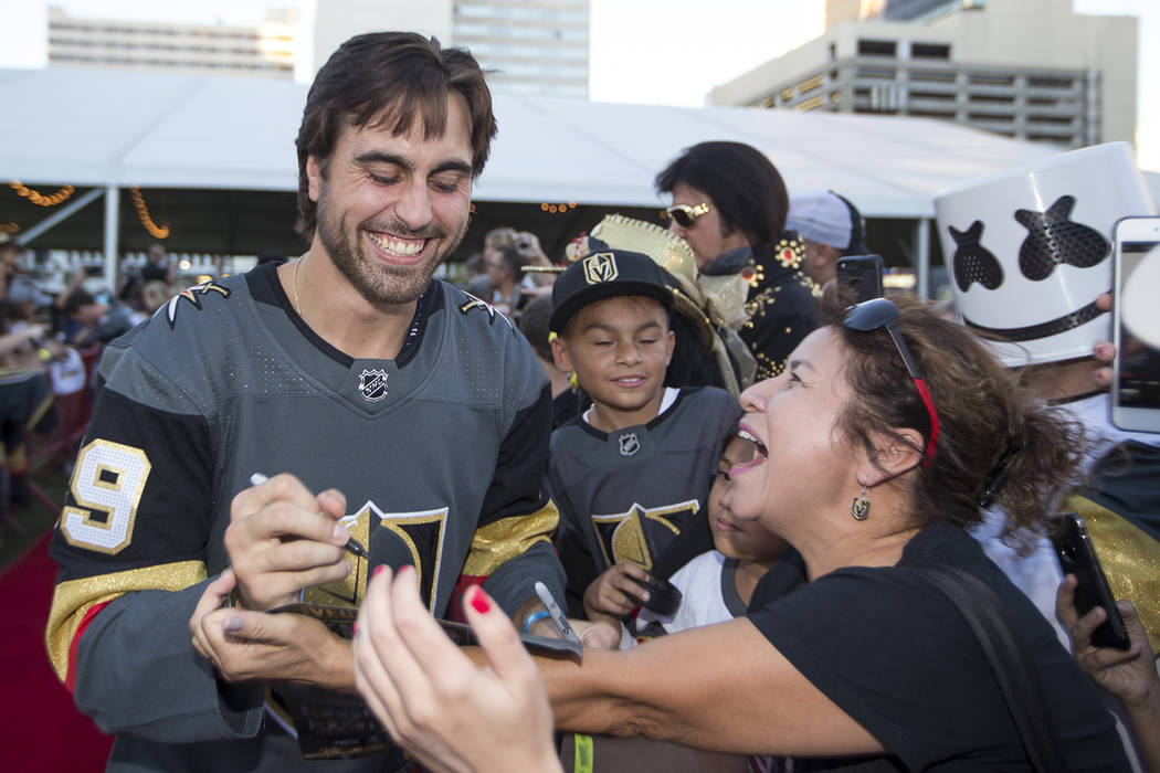 Vegas Golden Knights right wing Alex Tuch (89), left, signs autographs during a Vegas Golden Knights fan fest at the Downtown Las Vegas Events Center on Wednesday, Sept. 19, 2018. Richard Brian La ...