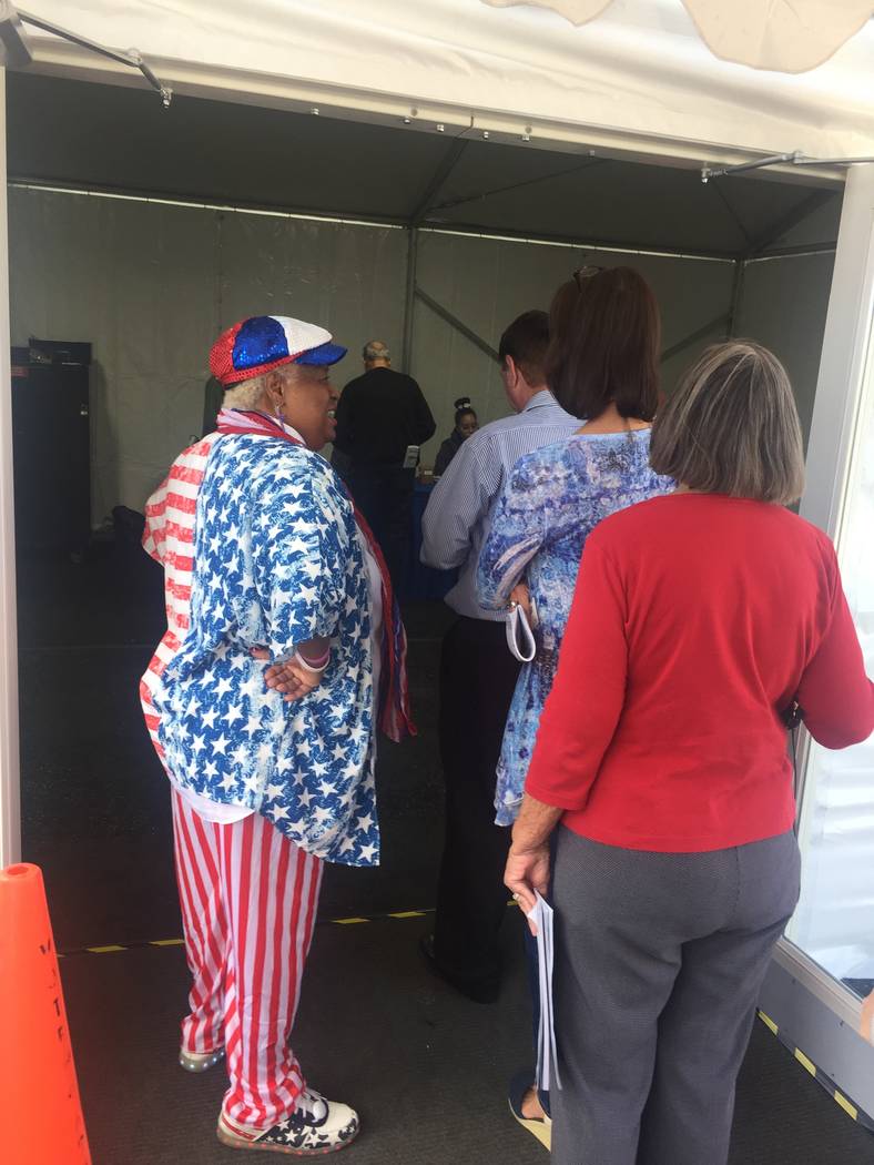 Poll worker Clarice Watkins welcomes voters to the Downtown Summerlin early voting site Saturday morning. Marian Green/ Las Vegas Review-Journal