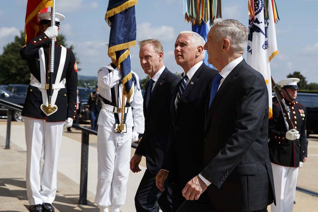 Vice President Mike Pence, center, is greeted by Deputy Secretary of Defense Pat Shanahan, left, and Secretary of Defense Jim Mattis before speaking at an event on the creation of a United States ...