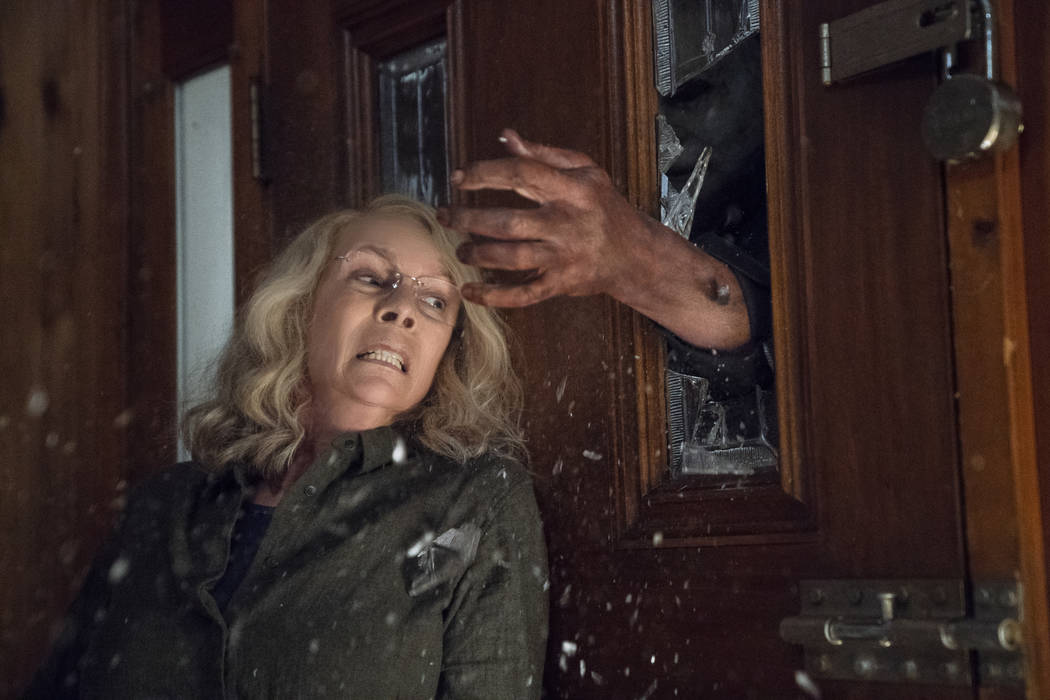 This image released by Universal Pictures shows Jamie Lee Curtis in a scene from "Halloween," in theaters nationwide on Oct. 19. (Ryan Green/Universal Pictures via AP)