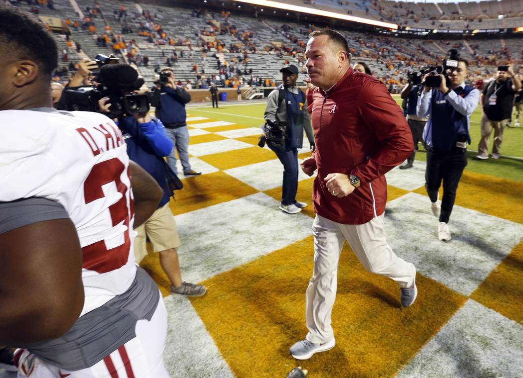 Former Tennessee head football coach Butch Jones leaves the field after an NCAA college football game against Tennessee Saturday, Oct. 20, 2018, in Knoxville, Tenn. Alabama won 58-21. (AP Photo/Wa ...