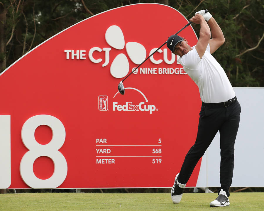 Brooks Koepka of the United States watches his shot on the 18th hole during the final round of the CJ Cup PGA golf tournament at Nine Bridges on Jeju Island, South Korea, Sunday, Oct. 21, 2018. (P ...