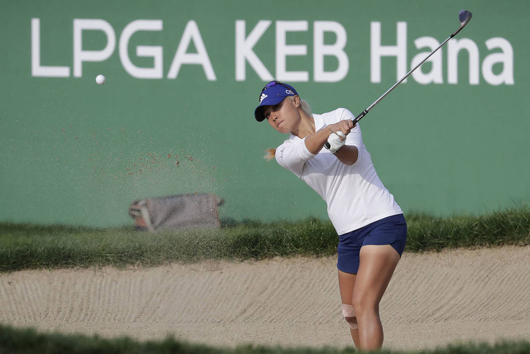 Danielle Kang of the United States hits a shot out of a bunker on the 18th hole during the final round of the LPGA KEB Hana Bank Championship at Sky72 Golf Club in Incheon, South Korea, Sunday, Oc ...