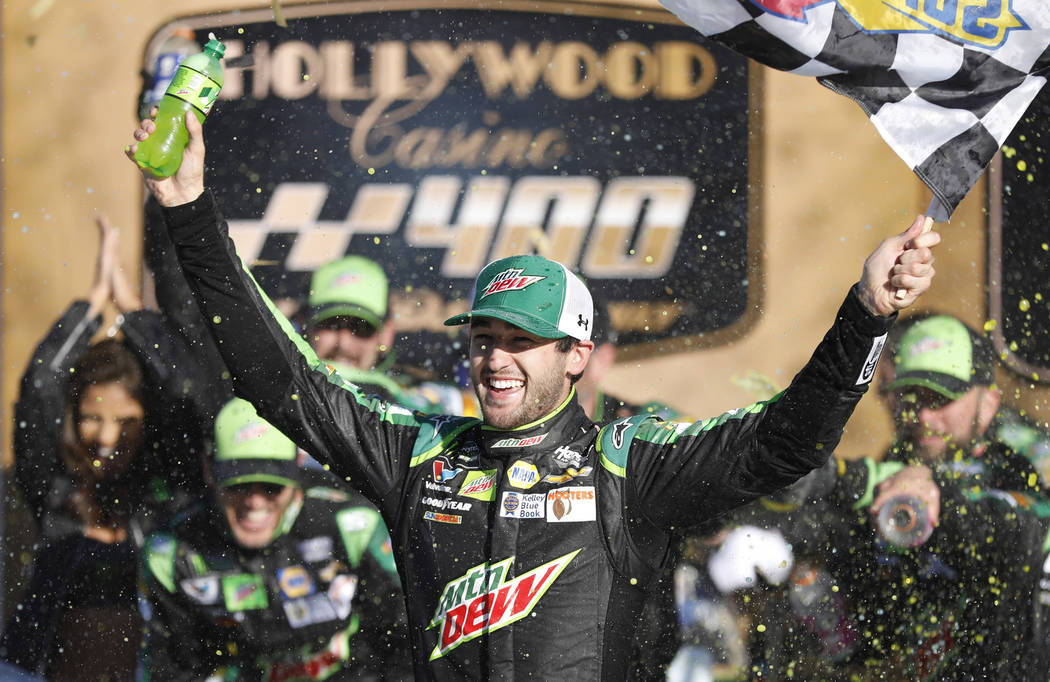 Chase Elliott celebrates winning a NASCAR Cup Series auto race at Kansas Speedway in Kansas City, Kan., Sunday, Oct 21, 2018. (AP Photo/Colin E. Braley)