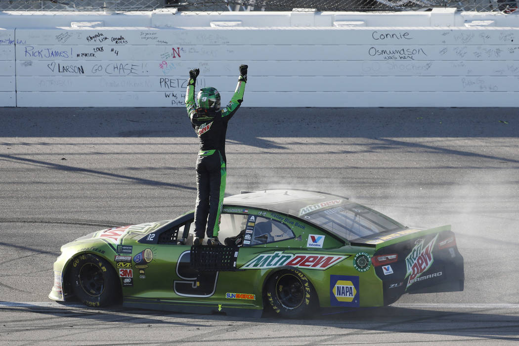 Chase Elliott celebrates after winning a NASCAR Cup Series auto race at Kansas Speedway in Kansas City, Kan., Sunday, Oct 21, 2018. (AP Photo/Colin E. Braley)