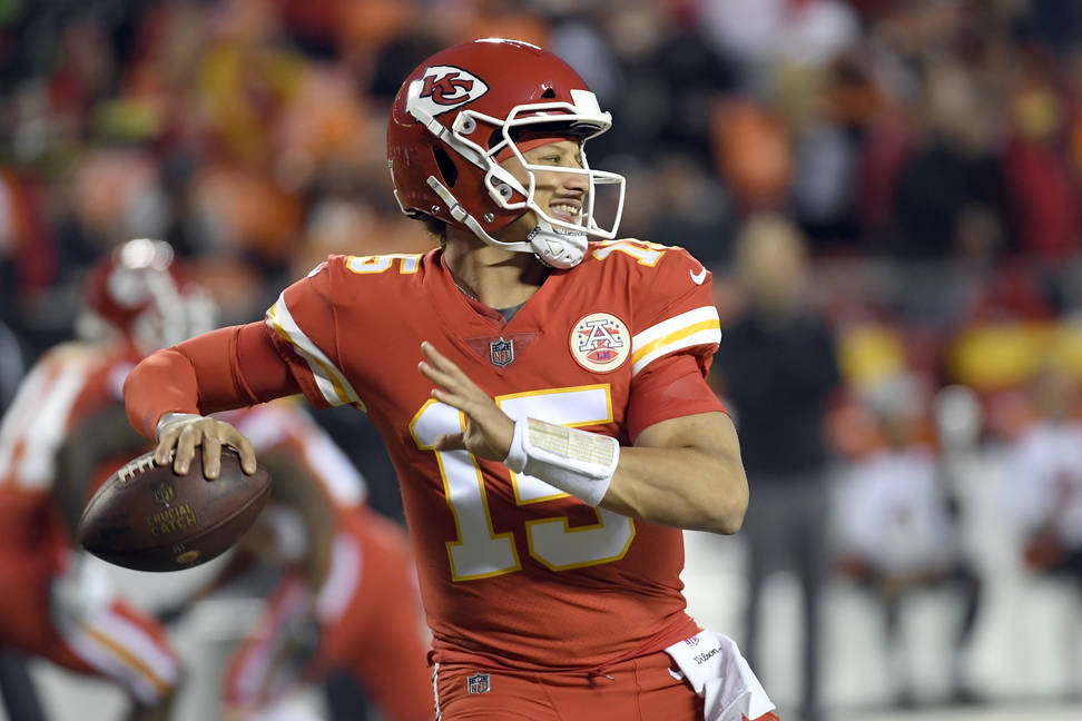 Kansas City Chiefs quarterback Patrick Mahomes (15) throws before an NFL football game against the Cincinnati Bengals in Kansas City, Mo., Sunday, Oct. 21, 2018. (AP Photo/Reed Hoffmann)