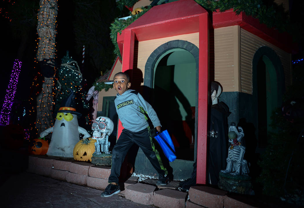 Noel Work, 4, steps out of a shed set up for HallOVeen at Opportunity Village's Magical Forest in Las Vegas, Sunday, Oct. 21, 2018. Caroline Brehman/Las Vegas Review-Journal