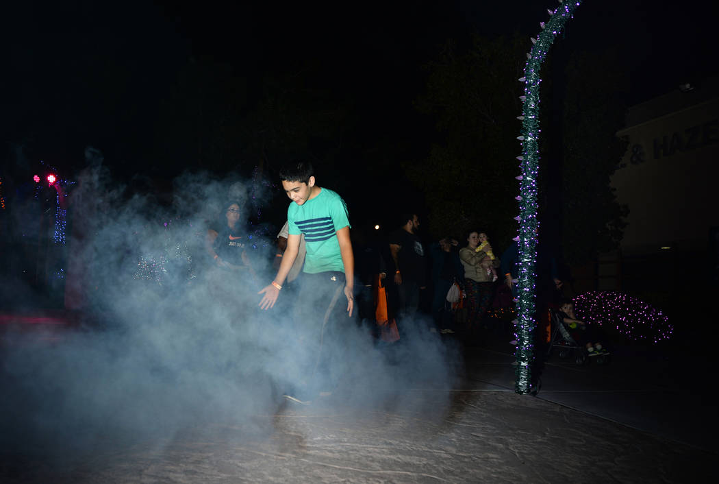 Daniel Delagarza walks through a cloud of fog at the HallOVween event taking place at Opportunity Village's Magical Forest in Las Vegas, Sunday, Oct. 21, 2018. Caroline Brehman/Las Vegas Review-Jo ...