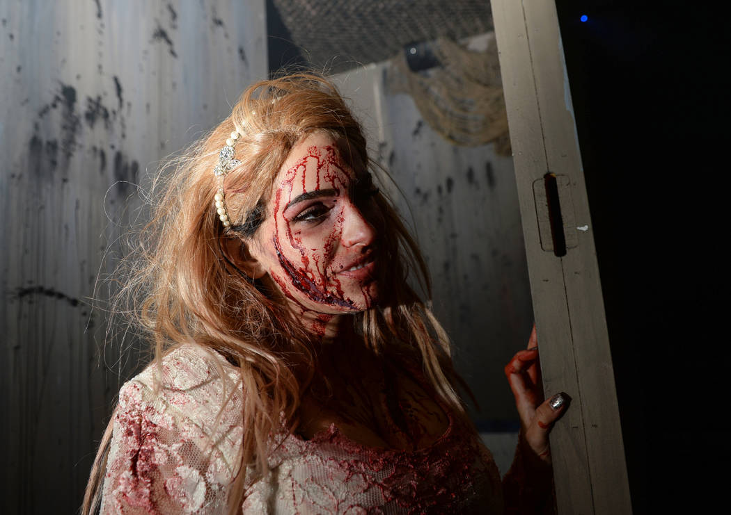 An actor peers around the corner at Vegas Freight Nights' haunted house at Opportunity Village's Magical Forest in Las Vegas, Sunday, Oct. 21, 2018. Caroline Brehman/Las Vegas Review-Journal