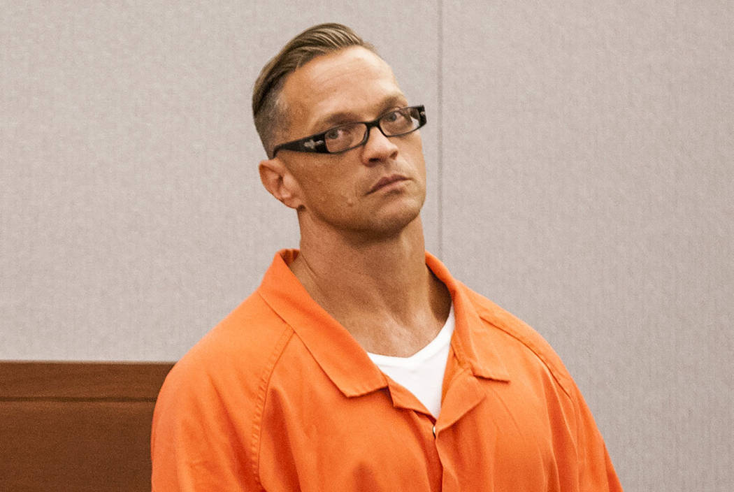 Two-time killer Scott Dozier stands for a hearing about his death sentence at the Regional Justice Center on Thursday, July 27, 2017. (Las Vegas Review-Journal)