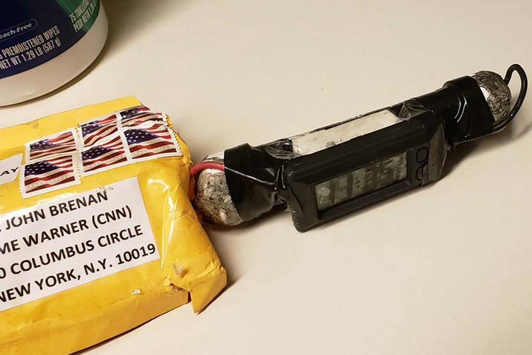This image obtained Wednesday, Oct. 24, 2018, shows a package addressed to former CIA head John Brennan and an explosive device that was sent to CNN's New York office. Federal authorities have det ...