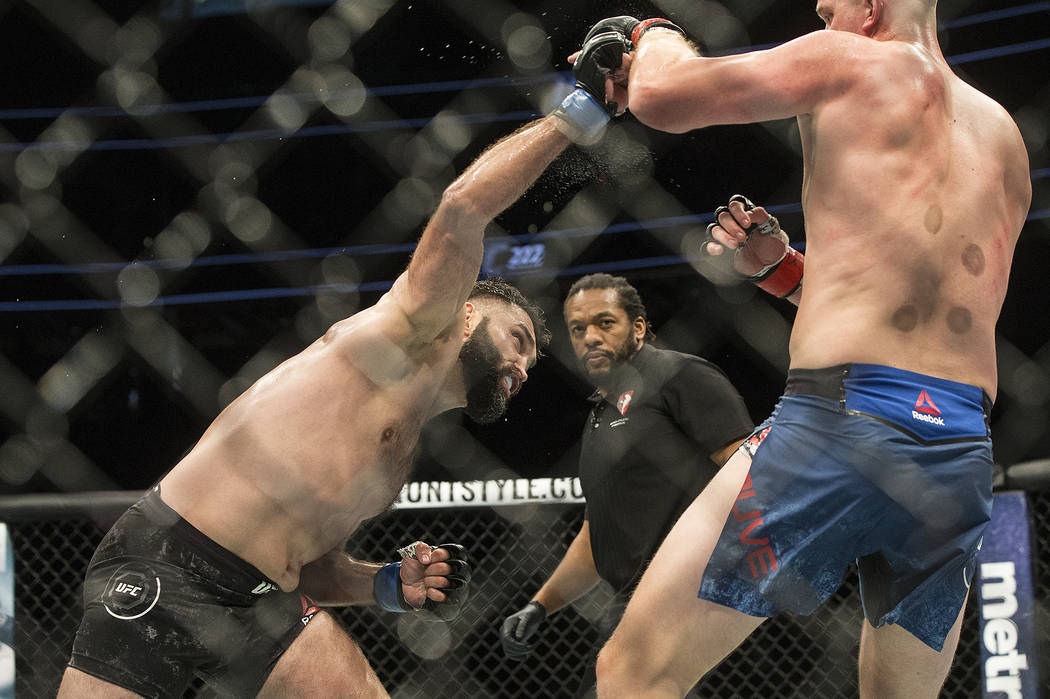 Andrei Arlovski, left, connects with a right hook against Stefan Struve during their heavyweight matchup at UFC 222 at T-Mobile Arena on Saturday, March 3, 2018, in Las Vegas. Arlovski beat Struve ...