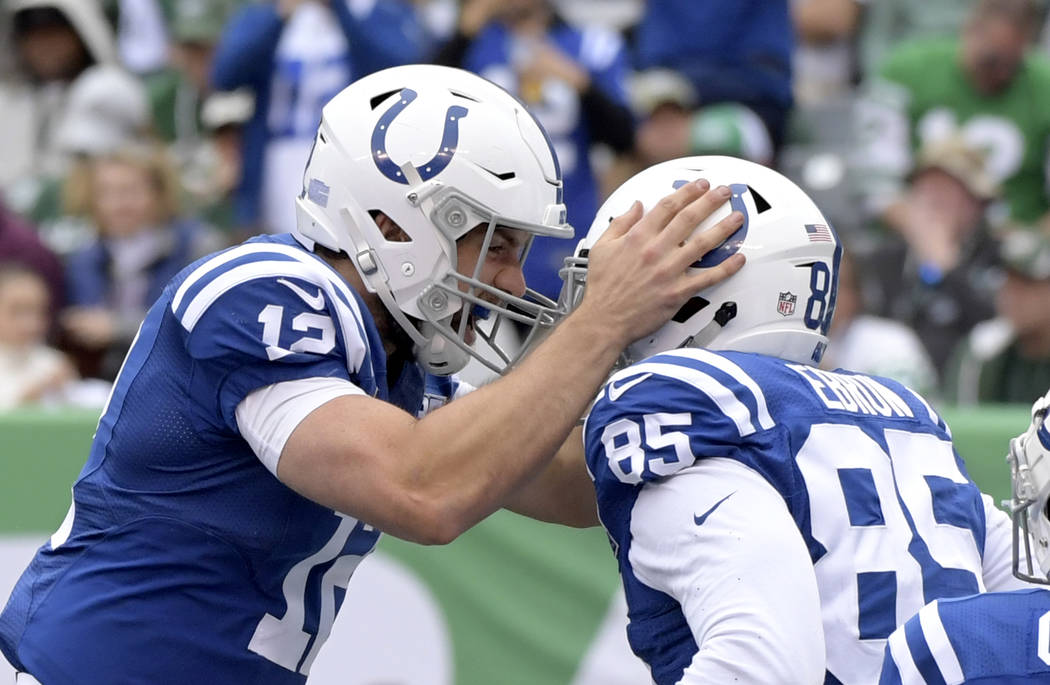 Indianapolis Colts quarterback Andrew Luck, left, celebrates after he and tight end Eric Ebron, right, connected for a touchdown pass and catch during the second half of an NFL football game again ...