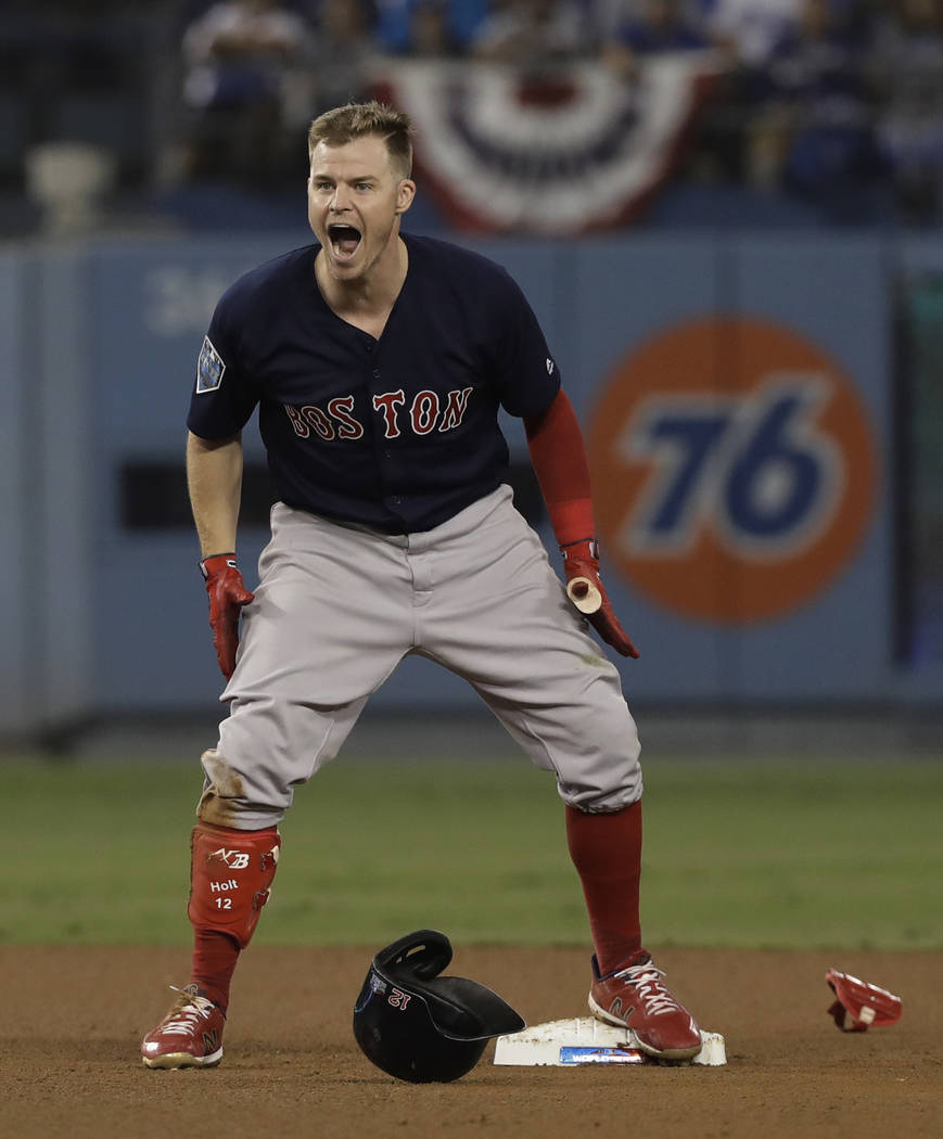 Boston Red Sox's Brock Holt reacts after hitting a double during