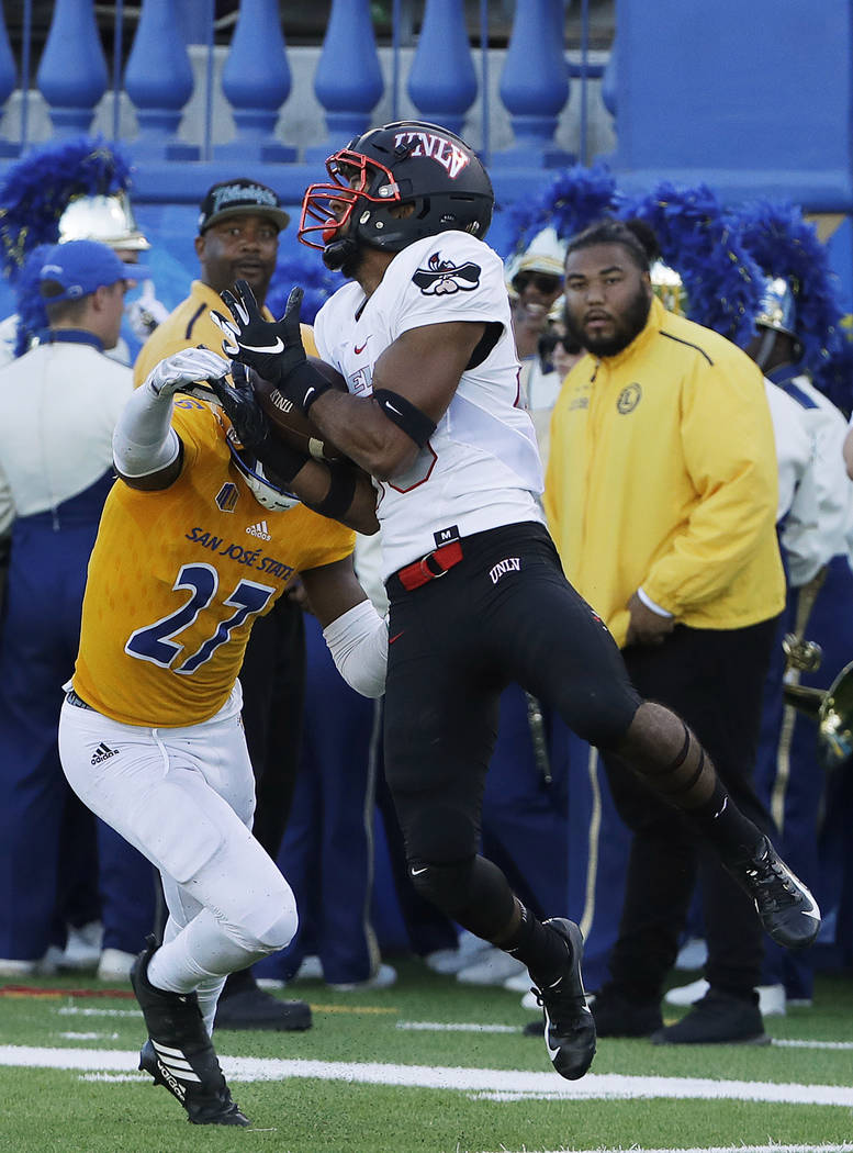 UNLV wide receiver Brandon Presley, right, catches a pass against San Jose State safety Jonathan Lenard Jr. (27) during the first half of an NCAA college football game in San Jose, Calif., Saturda ...