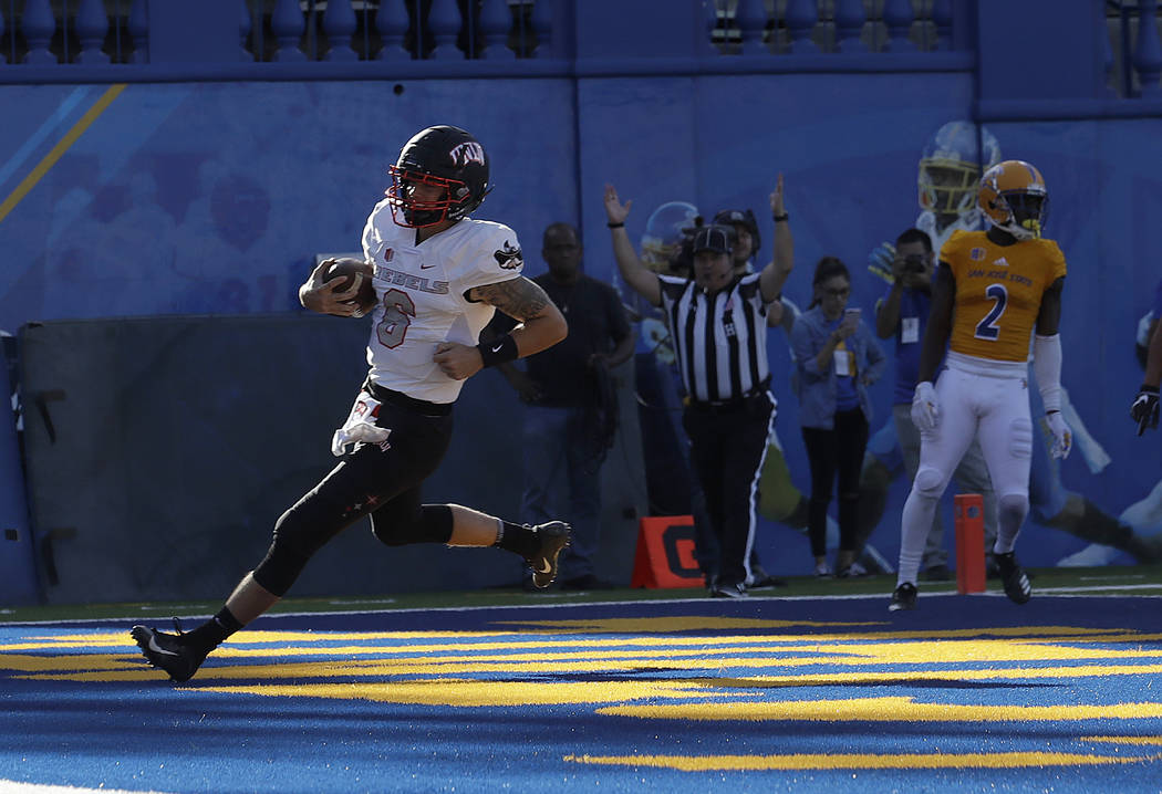 UNLV quarterback Max Gilliam (6) scores a touchdown against San Jose State during the first half of an NCAA college football game in San Jose, Calif., Saturday, Oct. 27, 2018. (AP Photo/Jeff Chiu)