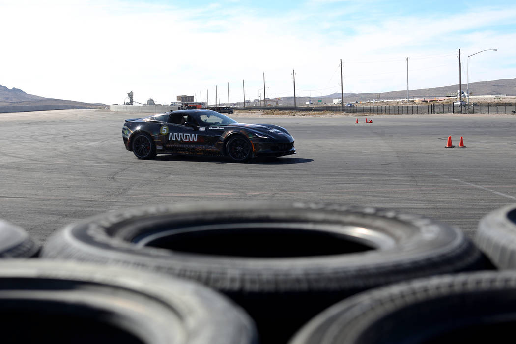 Bradley Boe drives a car at an event for Driven, a new rehabilitation center to help people with disabilities that will be built in downtown Las Vegas at SpeedVegas in Las Vegas, Sunday, Oct. 28, ...