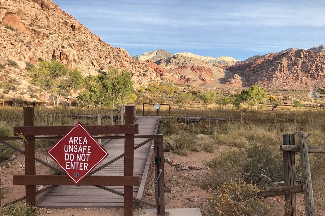 A warning sign blocks access to the Red Spring boardwalk at Red Rock Canyon National Conservation Area on Oct. 29. (Henry Brean/Las Vegas Review-Journal)