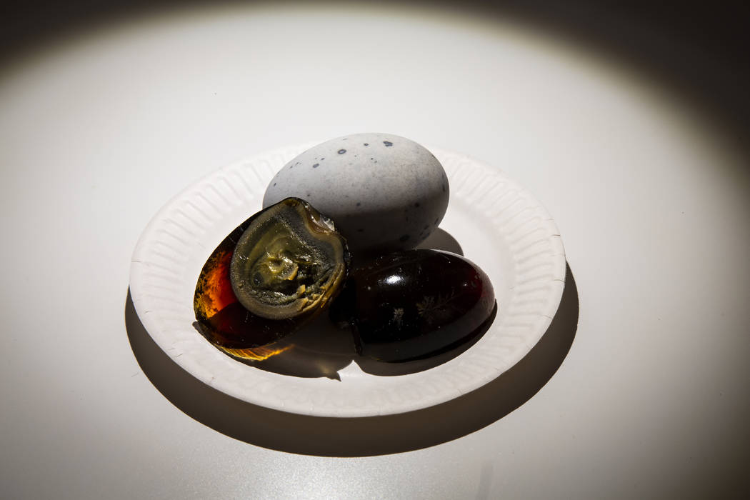In this photo taken on Sept. 22, 2018 century eggs on display at the Disgusting Food Museum, in Malmo, Sweden. The eggs are preserved in a mix of clay, quicklime, ash, salt and rice hulls for sev ...
