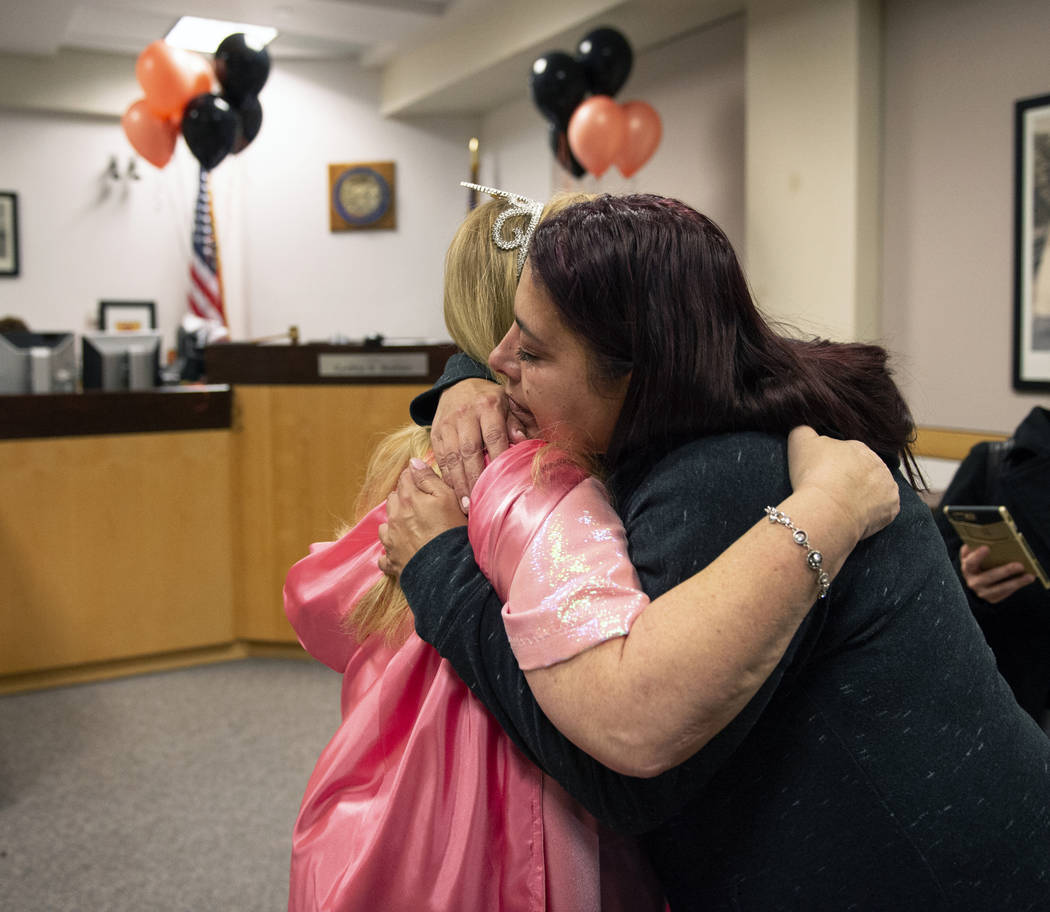 Dawn Hentzi hugs District Court Family Judge Cynthia Giuliani after finalizing the adoption process at Family Court in Las Vegas, Wednesday, Oct. 31, 2018. Caroline Brehman/Las Vegas Review-Journal