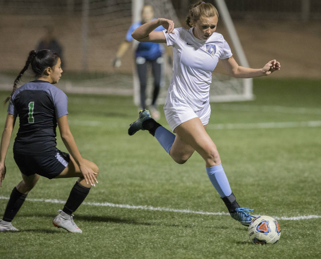 Foothill sophomore Aqui Williams (13) sprints for a loose ball with Green Valley junior defender Alyssa Marquez (1) in the second half on Wednesday, October 31, 2018, at Bettye Wilson Park, in Las ...