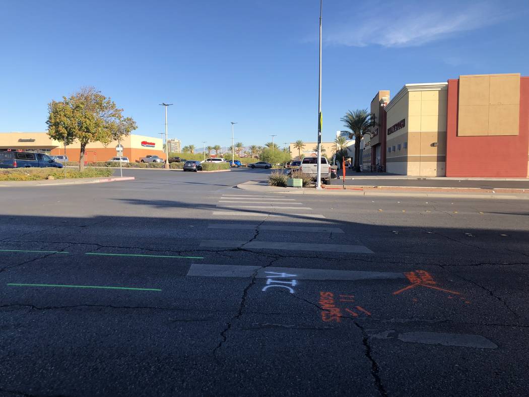 Remnants of a Las Vegas police investigation into a fatal crash on East Katie Avenue near South Maryland Parkway can be seen the morning after on Tuesday, Oct. 23, 2018. (Rio Lacanlale/Las Vegas R ...