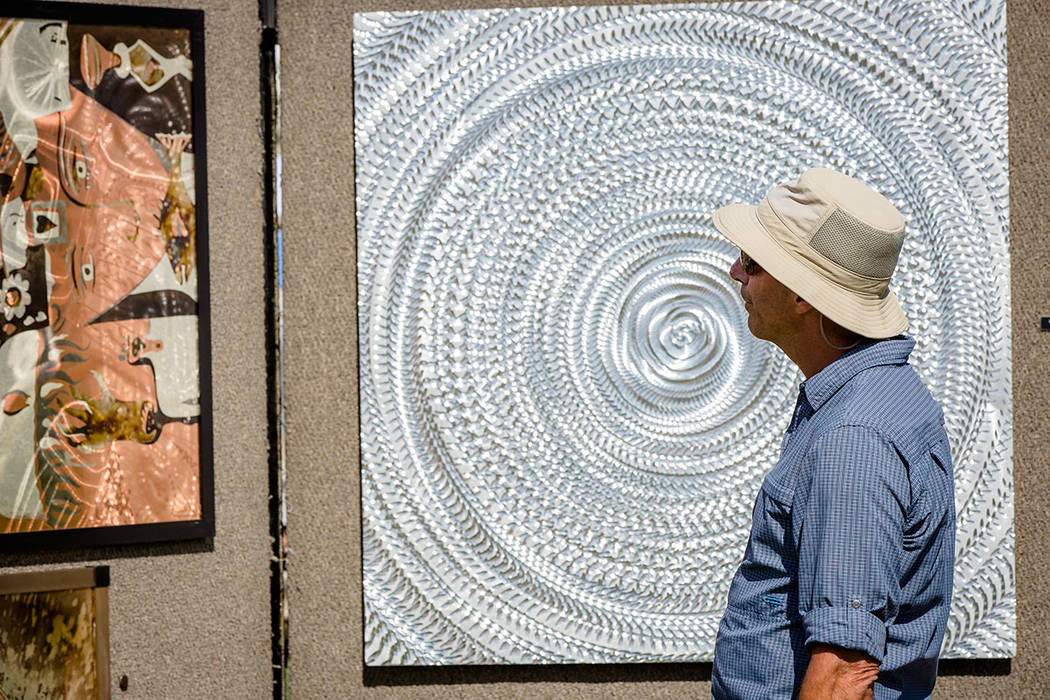 A man looks at art at the Summerlin Festival of Arts. (Summerlin)