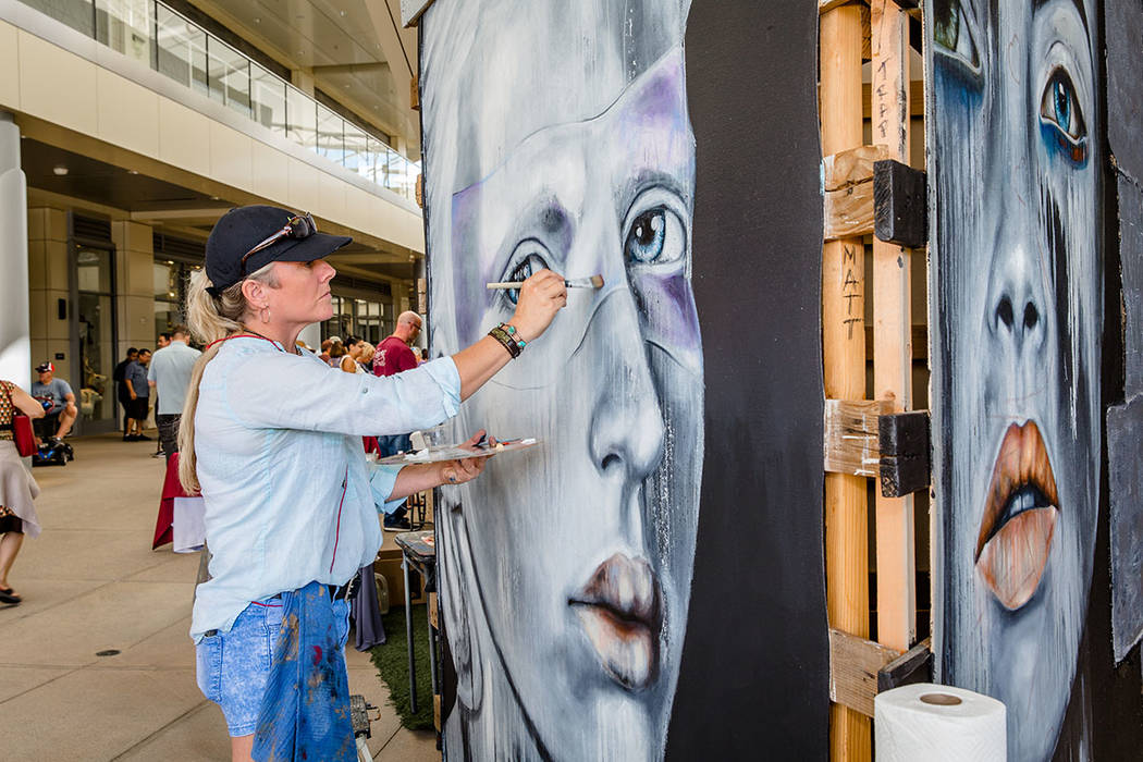 An artist works on a painting at the Summerlin Festival of Arts. (Summerlin)