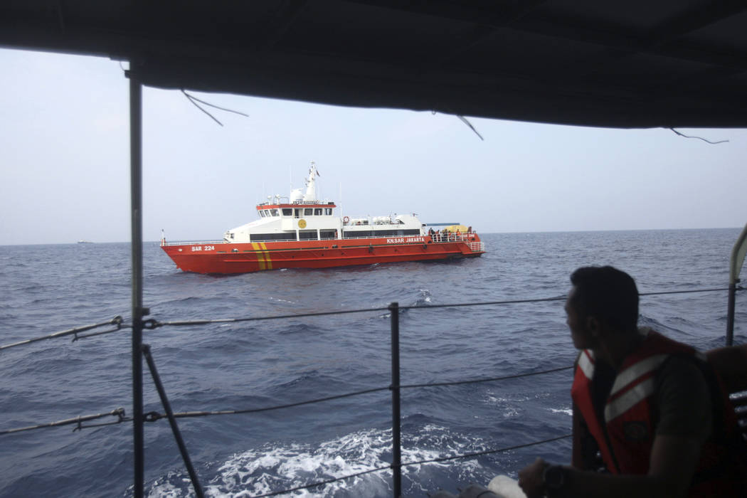 Rescue ships conduct a search operation for the victims of Lion Air plane crash in the waters of Tanjung Karawang, Indonesia, Wednesday, Oct. 31, 2018. A massive search effort has identified the p ...