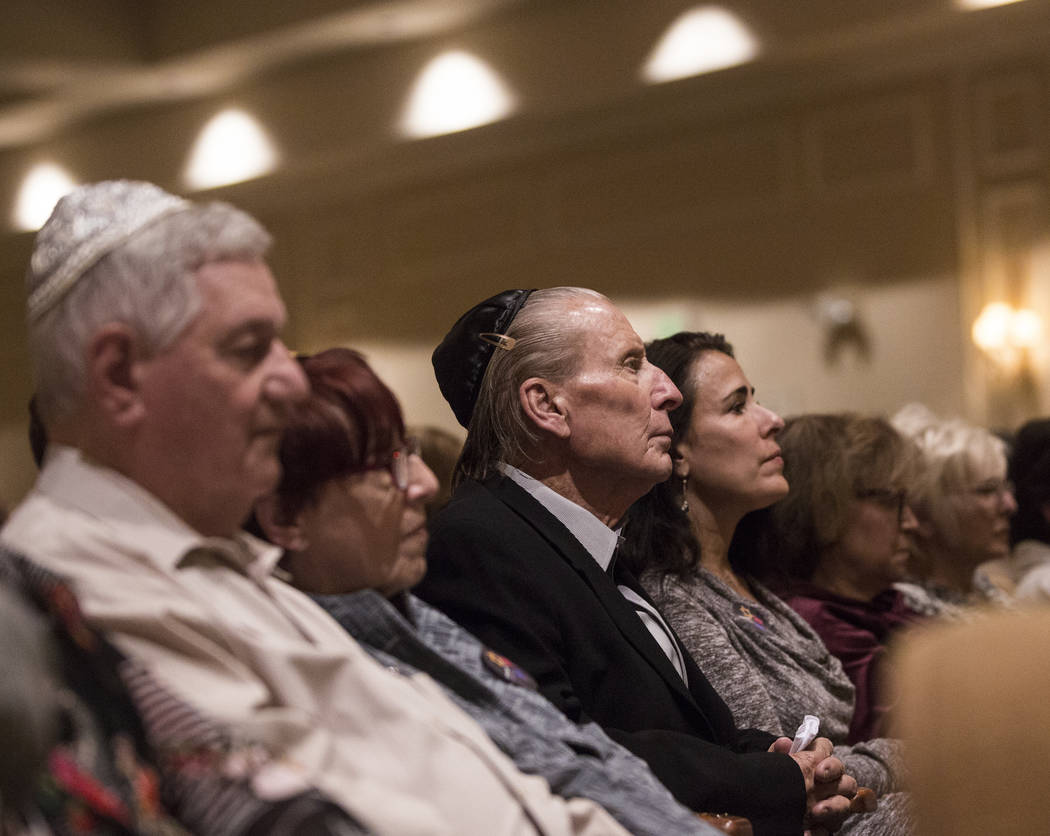 Attendees listen to a speaker during a vigil on Thursday, November 1, 2018, at Temple Beth Sholom in Las Vegas for the 11 people killed at the Tree of Life synagogue in Pittsburgh, Pa., on Saturda ...