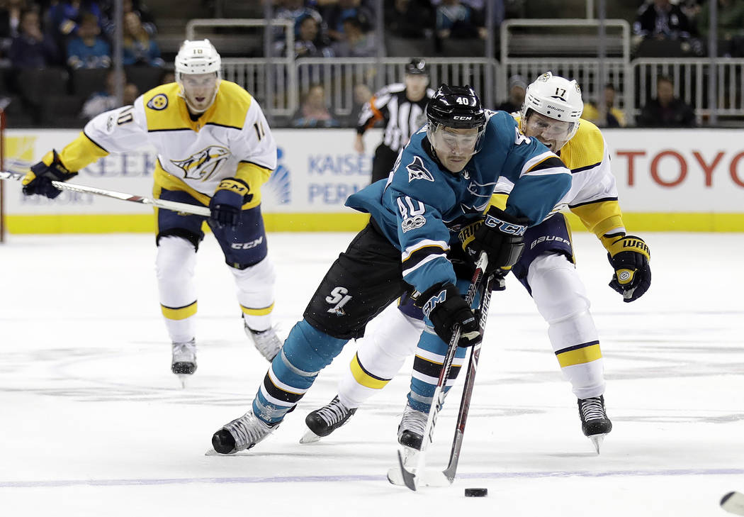 San Jose Sharks' Ryan Carpenter (40) is defended by Nashville Predators' Scott Hartnell (17) during the second period of an NHL hockey game Wednesday, Nov. 1, 2017, in San Jose , Calif. (AP Photo/ ...