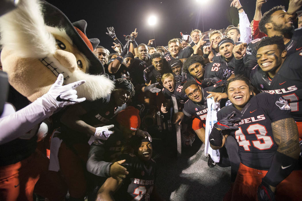 UNLV celebrates with the cannon after defeating the Nevada Wolf Pack 34-29 following an NCAA football game at Sam Boyd Stadium in Las Vegas on Saturday, Nov. 24, 2018. Richard Brian Las Vegas Revi ...