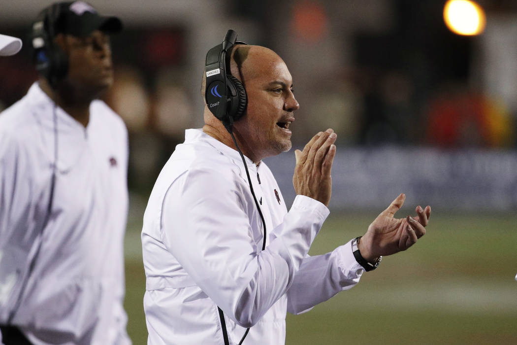 UNLV Rebels head coach Tony Sanchez claps after a play against the Fresno State Bulldogs during the first half of an NCAA college football game Saturday, Nov. 3, 2018, in Las Vegas. (AP Photo/John ...