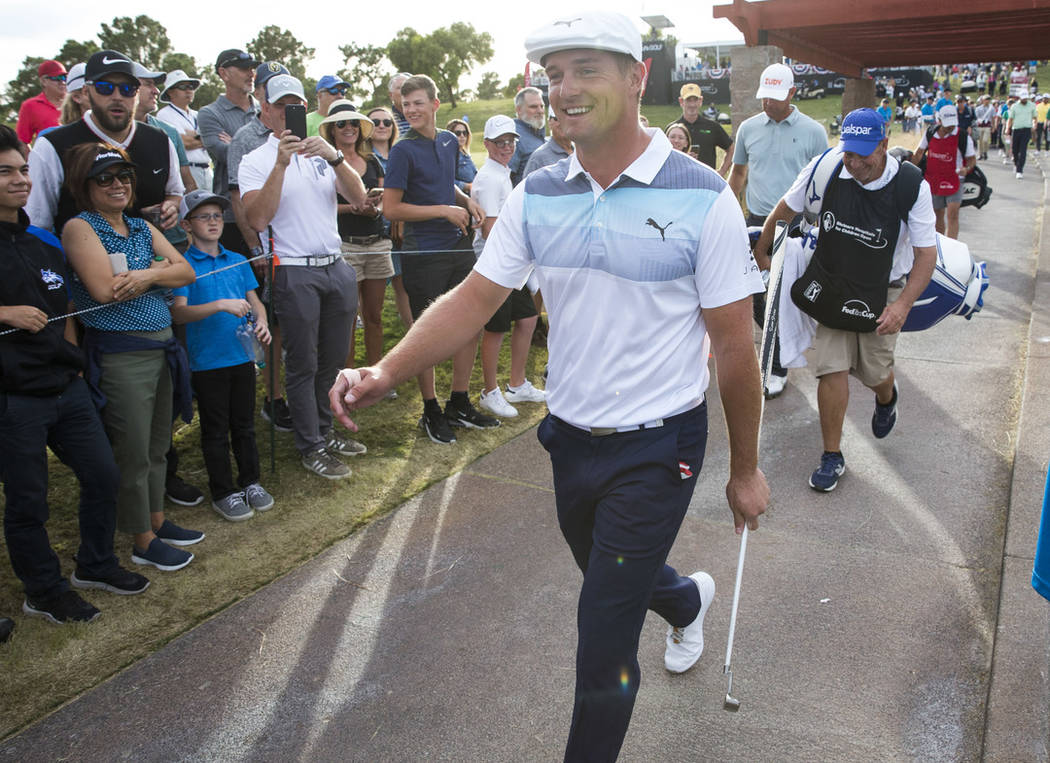 American golfer Bryson DeChambeau walks to the fairway after teeing off from the 17th box during the final round of the Shriners Hospitals for Children Open at TPC at Summerlin in Las Vegas on Sun ...
