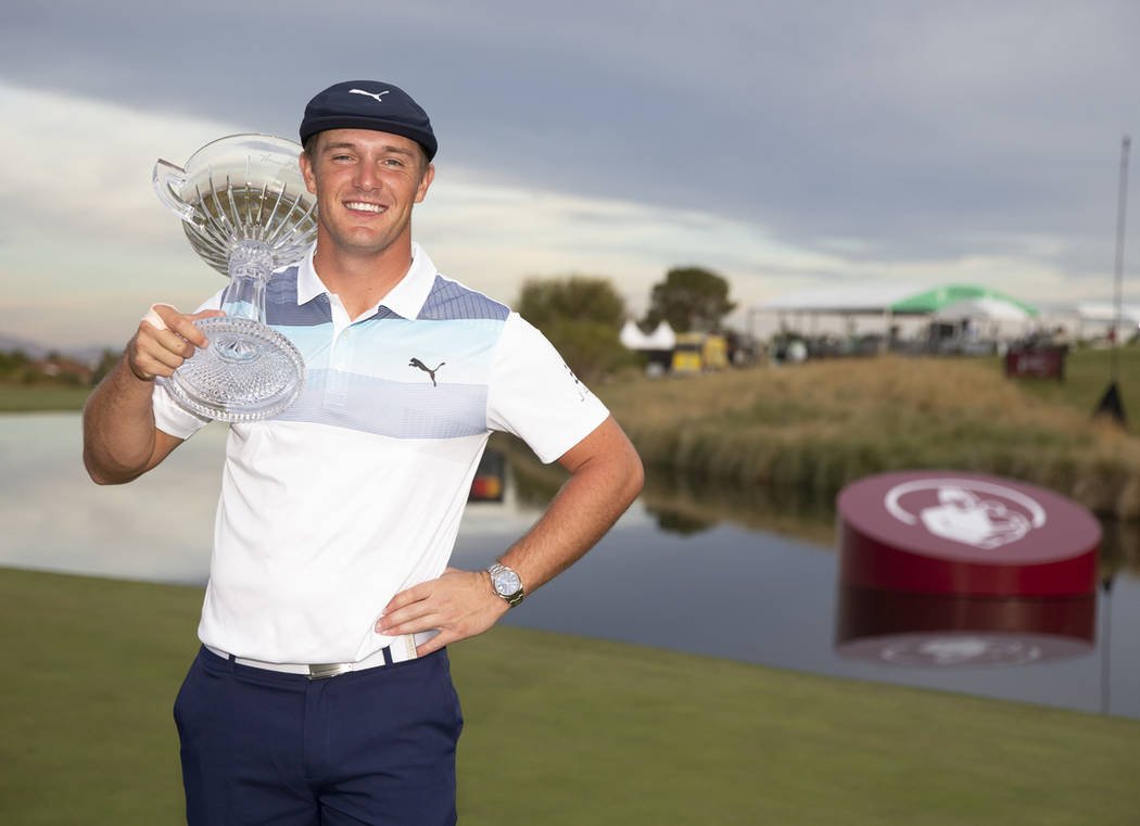 American golfer Bryson DeChambeau poses with the trophy after winning the Shriners Hospitals for Children Open at TPC at Summerlin in Las Vegas on Sunday, Nov. 4, 2018. Richard Brian Las Vegas Rev ...