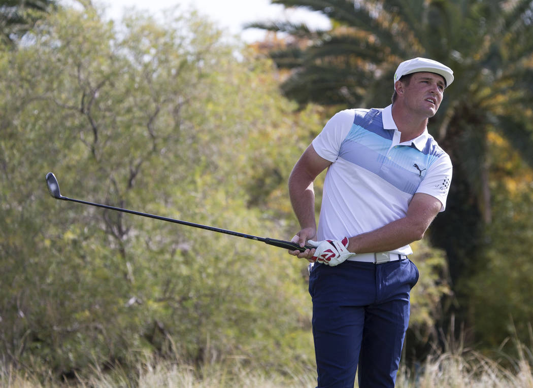 American golfer Bryson DeChambeau watches his shot after teeing off from the third box during the final round of the Shriners Hospitals for Children Open at TPC at Summerlin in Las Vegas on Sunday ...